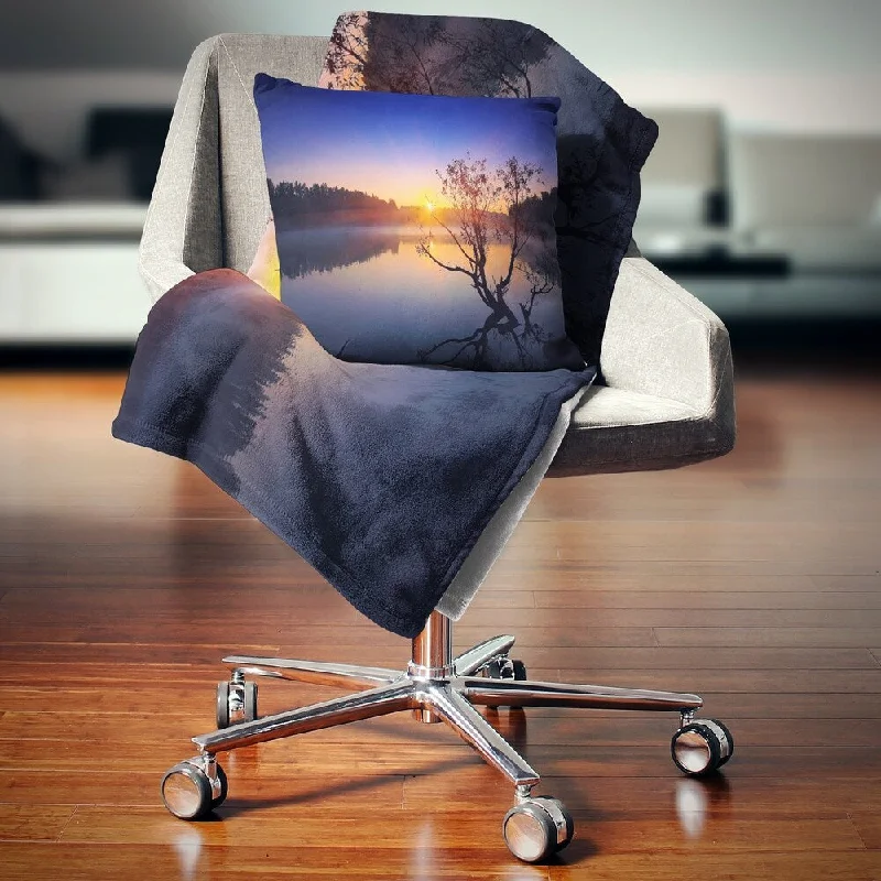 Alpaca wool blankets for a hypoallergenic and warm optionCotton blankets for breathability and a lightweight feelDesignart 'Lonely Tree in Pond in Blue' Landscape Fleece Throw Blanket