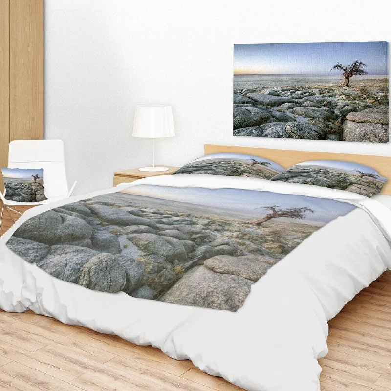 Fleece blankets for a cozy and plush textureRayon from bamboo blankets for a silky and breathable feelDesignart 'Baobab Tree on Rocky Terrain' Landscape Fleece Throw Blanket