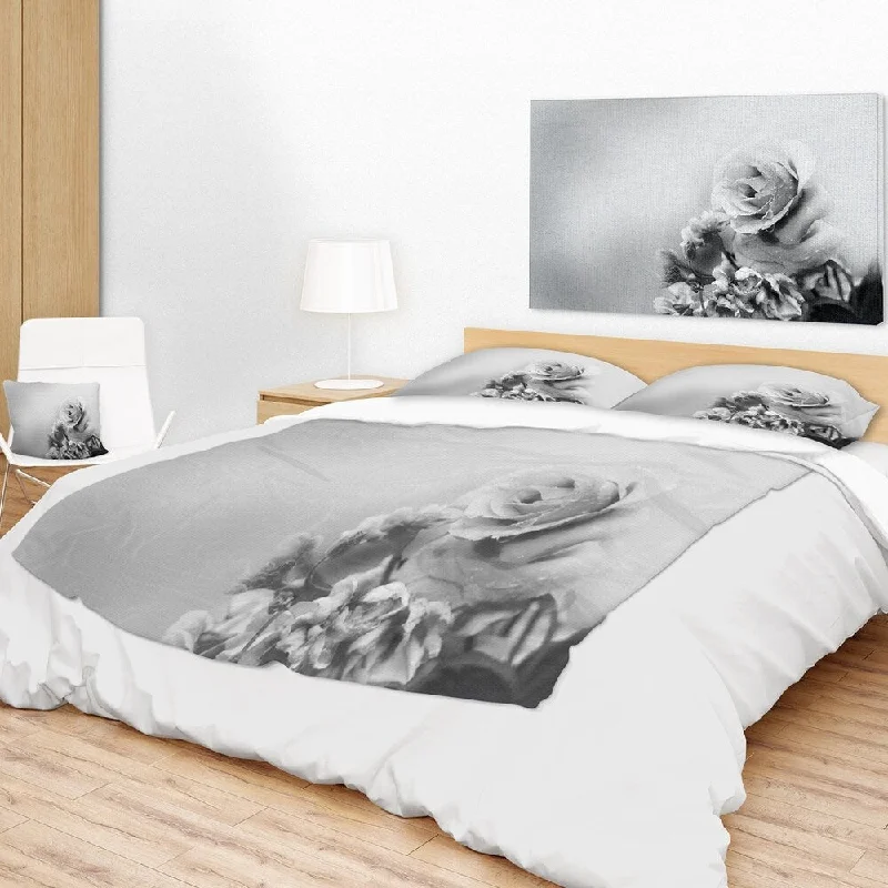 Cotton blankets for breathability and a lightweight feelFleece blankets for a cozy and plush textureDesignart 'Black and White Rose in Spring.' Floral Throw Blanket